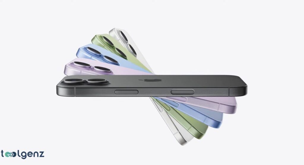 A fan of different colored smartphones, possibly the Apple iPhone 17 models, is shown horizontally. The primary, dark gray phone is in the center, and the other phones, in white, green, and lilac, are fanned out in a arc beneath it, suggesting a range of color options.