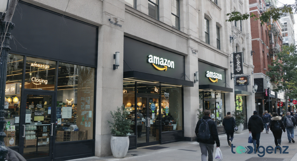A modern grocery storefront with large glass windows and black signage featuring red "Closing Soon" posters as pedestrians walk by on the sidewalk.