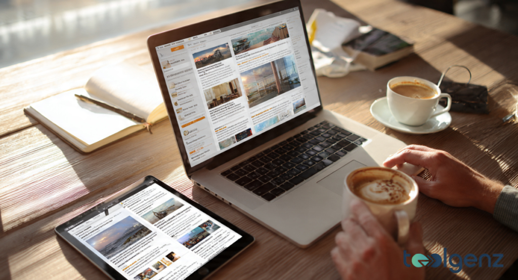 A clean workspace featuring a laptop, tablet, and a fresh cup of coffee.
The screens show a completed and organized news feed layout.